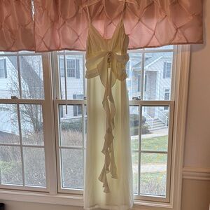 Elegant White Sleeveless Dress with Ruffle Detail